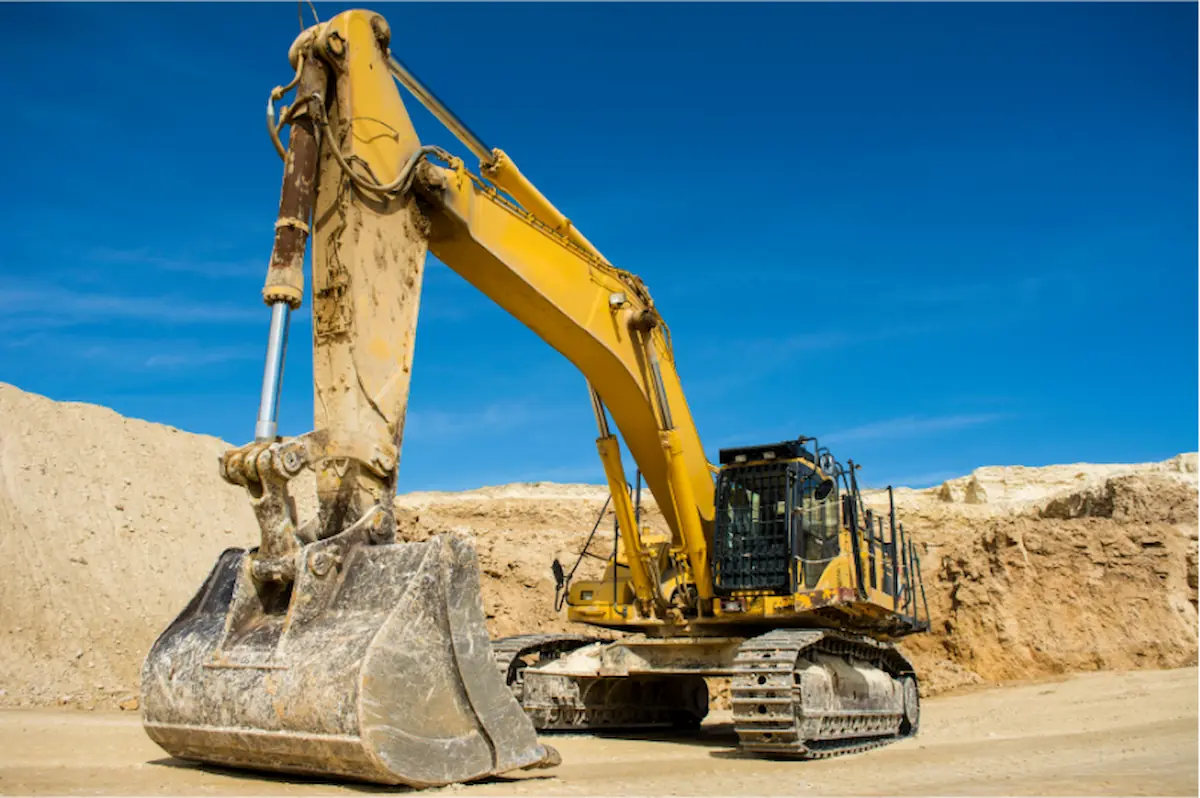 Excavator with heavy-duty bucket attachment